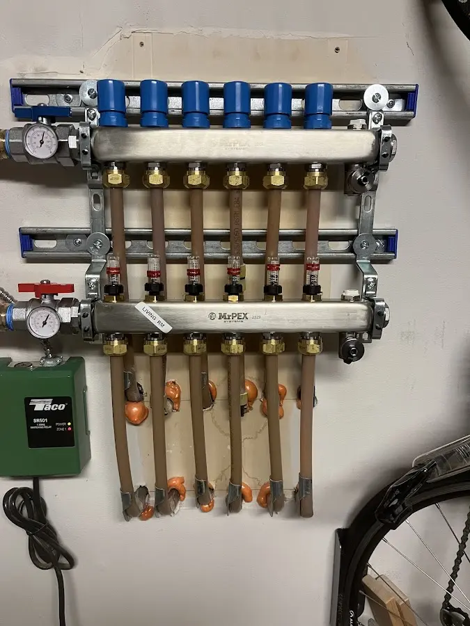 Plumber performing Water Heater Repair at a residential property in Champaign